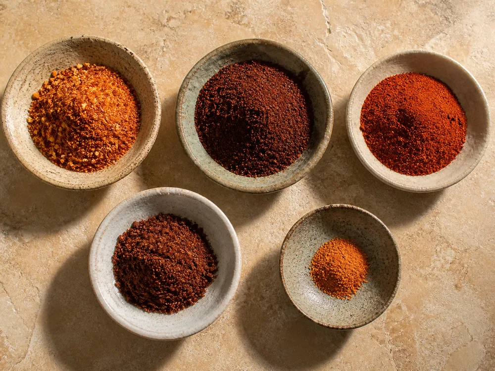 Paprika and cayenne blend, ancho, paprika, chipotle, and cayenne in measured dishes - Aleppo pepper substitutes | KnowTheSpices