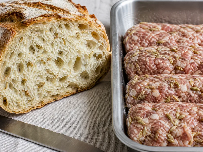 Visible fennel seeds in sliced bread crumb and a chilled sausage mixture - anise seed texture replacement | KnowTheSpices