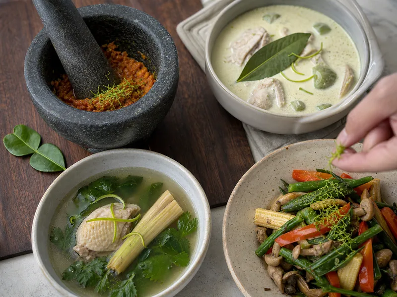 Makrut zest, bay leaf with lime zest, lemongrass with zest, and plain lime zest shown in four different cooking applications