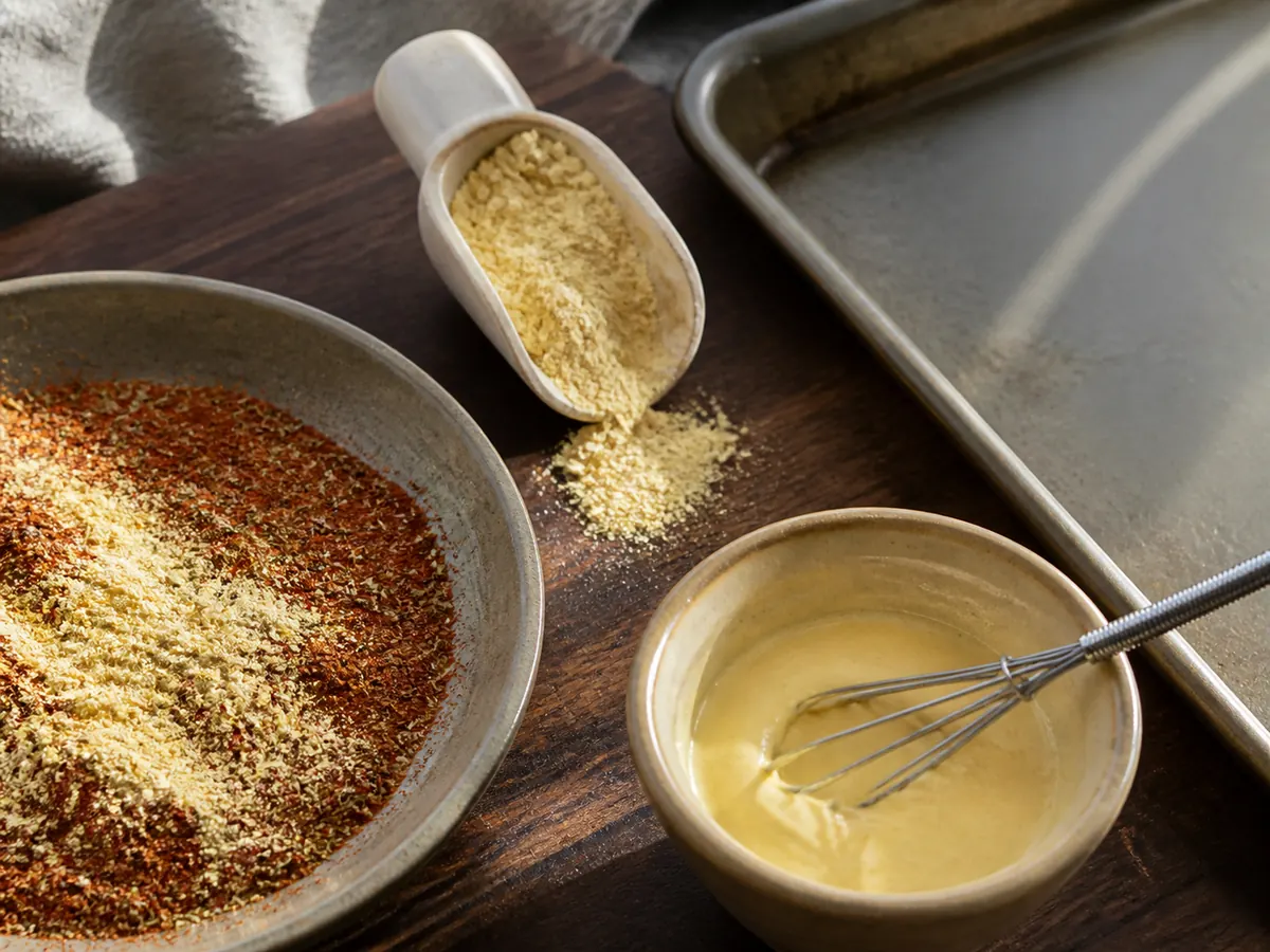 Mustard powder divided between a dry spice rub and cool-water paste - mustard seed substitutes | KnowTheSpices