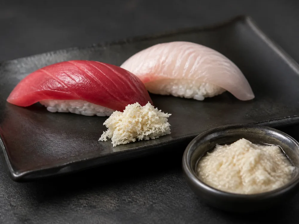 Firm fresh horseradish paste and watery prepared horseradish beside sushi - wasabi substitute for sushi | KnowTheSpices