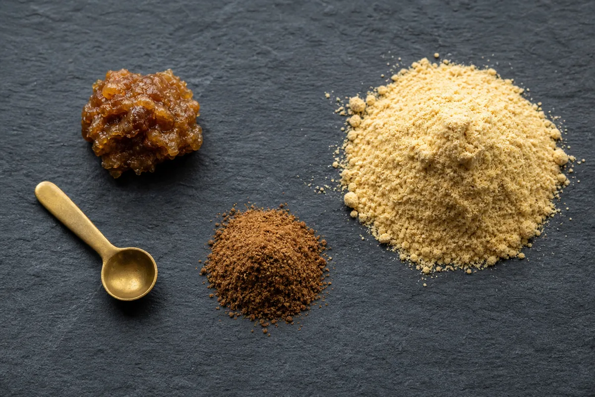 Asafoetida resin lump, pure ground resin, and pale compounded hing arranged separately - asafoetida forms | KnowTheSpices