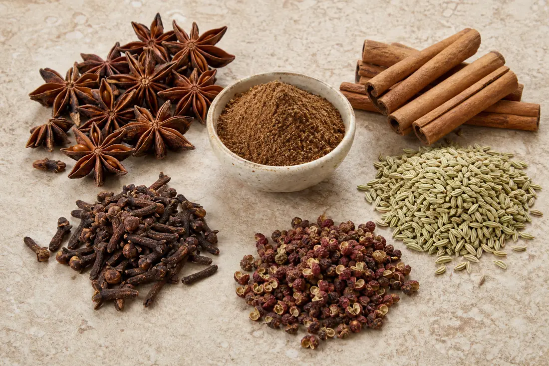Star anise, cinnamon, fennel seed, cloves, Sichuan peppercorns, and Chinese five spice powder